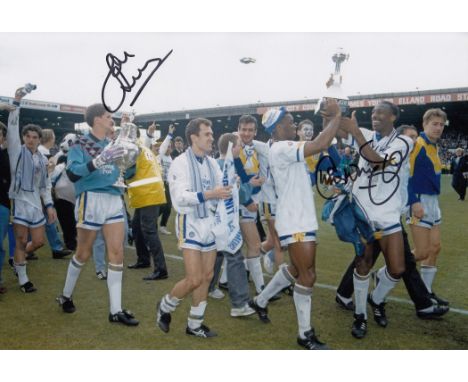 Football Autographed Leeds United 12 X 8 Inch Photo Colour, Depicting Players Parading The Barclay League Championship Trophy