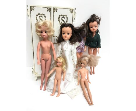 Three Pedigree Sindy dolls, together with Model Toys Daisy Mary Quant doll and Mattel Tutti (F-G, with headless Dollikins dol