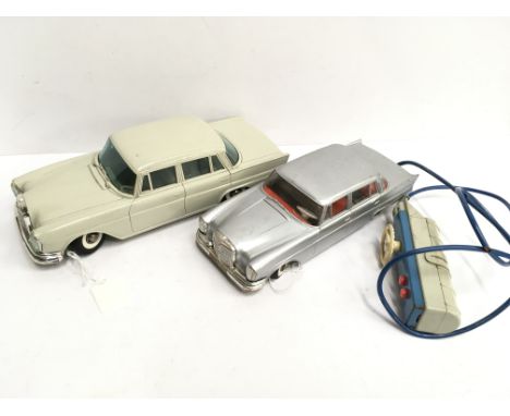 Two Gama (Germany) Mercedes Benz cars: friction drive model with grey plastic body and tinplate base, length 25cm (G+. motor 