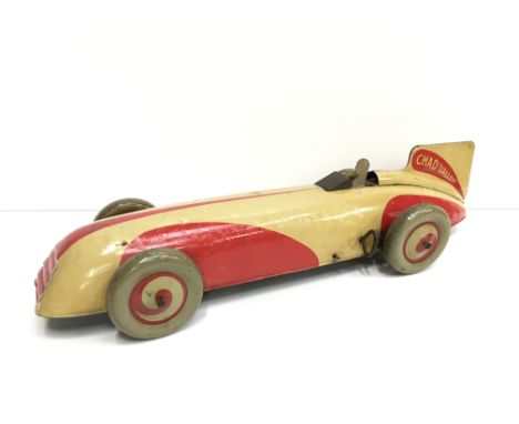Chad Valley (England) Mechanical Racing Car: tinplate clockwork model in red and cream with grey/cream and red balloon wheels