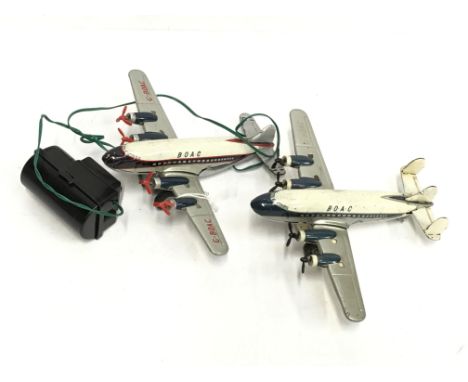 Two Marx BOAC tinplate aircraft: one friction drive, the other battery operated with hand held remote control unit. Wing span