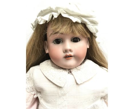 Late 19th/ early 20th century Max Handwerck (Germany) bisque head doll, mold number '4', with weighted brown eyes, open mouth