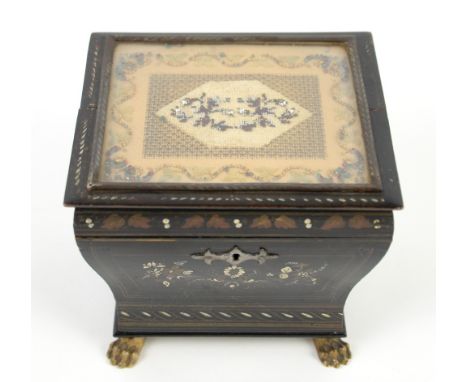 19th century  painted  tea caddy, the top inset with an embroidered panel  on lions' paw feet,  15cm wide.    