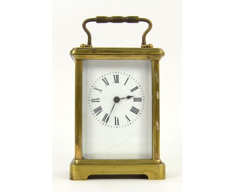 Brass carriage clock and an early 20th century  mahogany banjo barometer and thermometer in inlaid case.    
