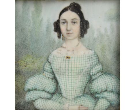 19th century portrait miniature on ivory of a woman with dark hair in a green and white checked dress, in gilded frame, with 