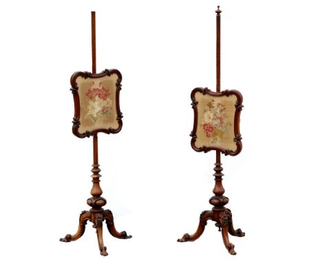 Pair of 19th century mahogany  pole screens inset with floral tapestry panels 145cm high  .    