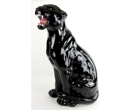 Large ceramic black glazed figure of a seated Panther, the base marked Diesel, approx 86cm.    