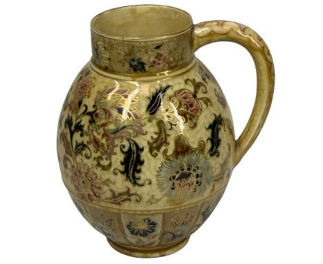 A ZSOLNAY PECS JUG - with floral decoration, 23cms tall