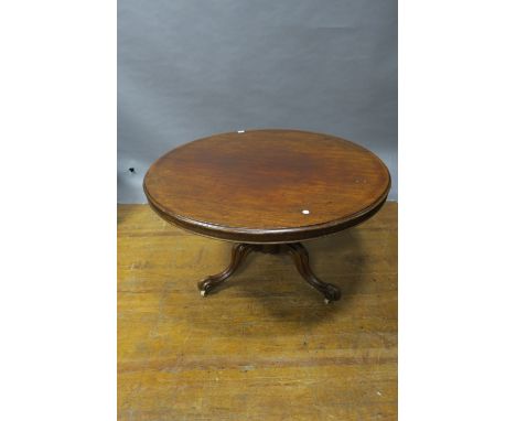 A VICTORIAN MAHOGANY POD TABLE, the oval top above a baluster column on tripod support with scroll toes,73cms x 118cms diamet