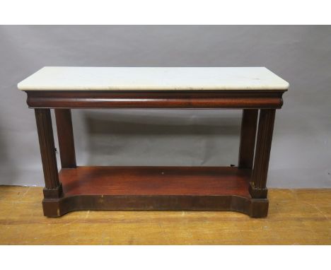 A MAHOGANY CONSOLE TABLE, surmounted with a white and veined marble top cavetto frieze raised on fluted front supports and co