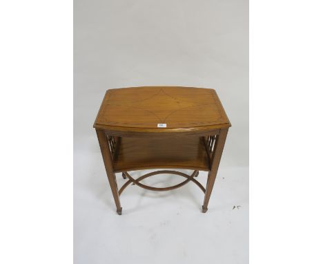 AN EARLY 20th CENTURY SATINWOOD INLAID OCCASIONAL TABLE the rectangular bowed top with lion inlay and moulded rim above a sha