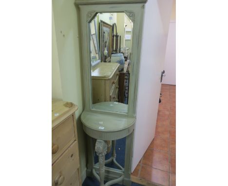 A CONTINENTAL STYLE GREEN PAINTED CONSOLE TABLE AND MIRROR, the rectangular top with trellis work panel centred by a circular