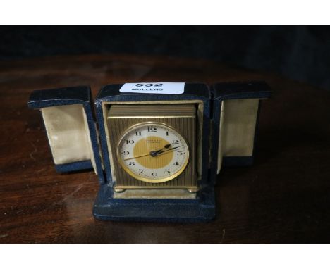 A 20th CENTURY BRASS FRAMED TRAVELLING CLOCK of rectangular form the dial signed Brooke and Son Edinburgh in a leather carryi