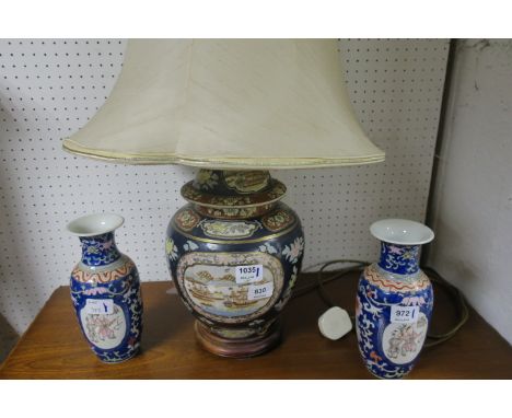 A PAINTED GLAZED PORCELAIN TABLE LAMP  of circular tapering form decorated with shipping scenes with cream silk shade togethe