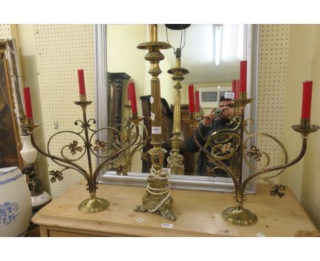 A PAIR OF BRASS FRAMED THREE LIGHT ECCLESIASTICAL CANDELABRUM, scrolled arms terminating in carved foliates, together with a 