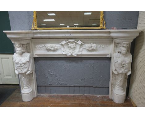 AN EXTREMELY FINE AND IMPRESSIVE WHITE MARBLE CHIMNEY PIECE the rectangular bowed shelf above a carved panel with armorial pl