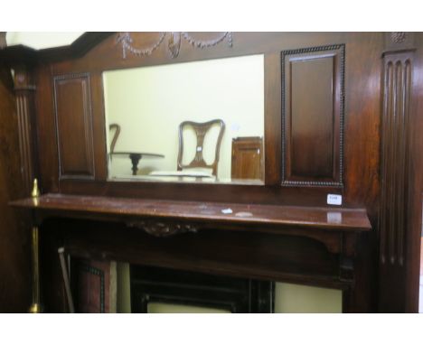 A GEORGIAN STYLE MAHOGANY FRAMED FIRE SURROUND, the superstructure with rectangular bevelled plate headed by ribbon tied swag