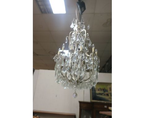 A VERY FINE CONTINENTAL SILVERED AND CUT GLASS 12 BRANCH CHANDELIER hung with pendant drops  175cm drop