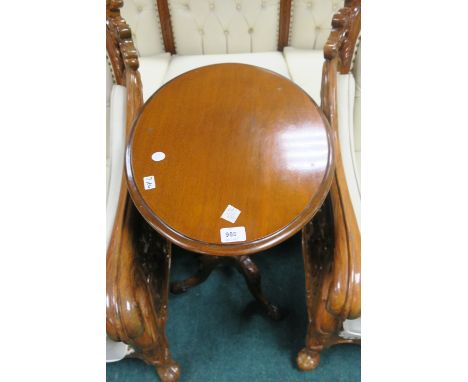 A MAHOGANY OCCASSIONAL TABLE, the oval moulded top above a baluster column on carved tripod support,69cms x 60cms x 43cms.