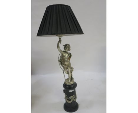 A CONTINENTAL STYLE TABLE LAMP MODELLED AS A CLASSICAL CHILD holding aloft a torch with black silk shade and raised on a blac