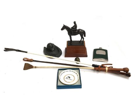 A resin figure of jockey up, height including plinth 25cm; together with a horseshoe and cap inkwell; brass jockey's cap; Roy