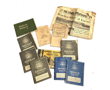 A lot of WWII German and French 'Restricted' phrase books; basic field manual; ration book holder; etc 