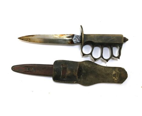 A WWI period US army trench fighting knife with brass knicke duster grip, marked marked 'U.S. 1918, LF&amp;C - 1918', with sh