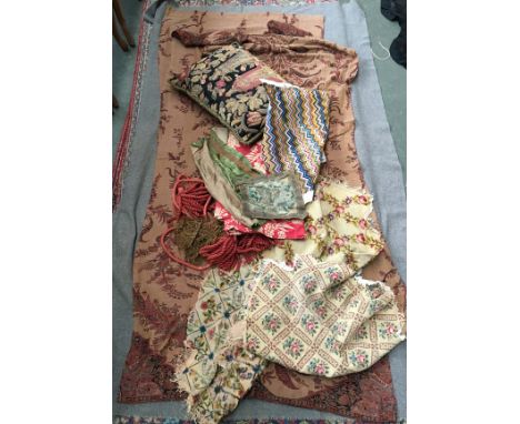 A box of mixed fabric samples and embroideries, to include some seat covers, an embroidered cushion, and two pieces of paisle