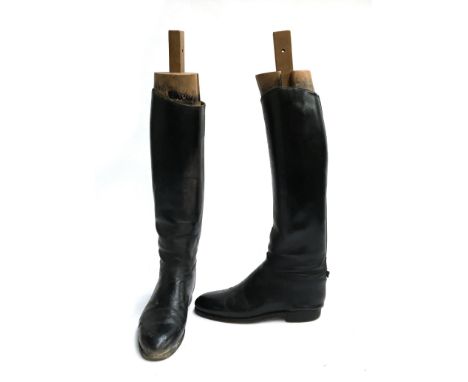 A pair of gent's black leather hunting boots with wooden trees, approx. size 10, with red boot bags 