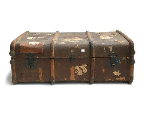 A vintage travel trunk with wooden banding, travel stickers, 92x33x55cm 