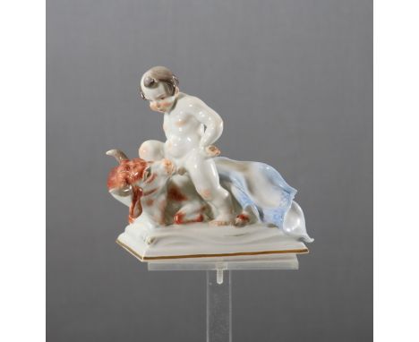 Meissen PorzellanfigurMitte 20. Jh., Entwurf Paul Börner, Stier mit Putto, aus der Serie der Tierkreiszeichen, am Boden Nr. R