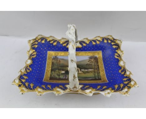 AN EARLY 19TH CENTURY CHAMBERLAINS WORCESTER PORCELAIN SWEETMEAT BASKET with crabstock handle, the sole painted with a landsc