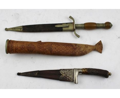 THREE HUNTING KNIVES, includes one with the blade inscribed "F. Herder Abrsohn Solingen", in leather scabbard 