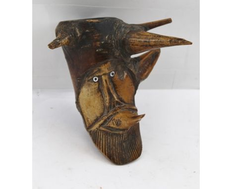 A 19TH CENTURY CARVED ROOTSTOCK PIPE, the bowl depicting a bearded horned mask with bead eyes 