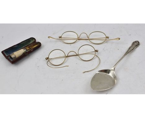 A LATE VICTORIAN SILVER MOUNTED CHEROOT HOLDER in original case, a SILVER CONSERVE SPOON and two pairs of wire framed SPECTAC