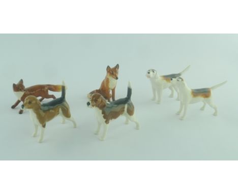 A COLLECTION OF BESWICK CERAMIC FIGURES comprising; a seated fox, a running fox, two beagle hounds and two other hounds (6) 