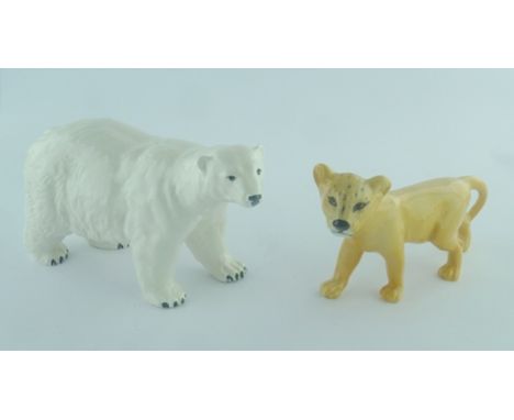 A BESWICK CERAMIC FIGURE OF A POLAR BEAR and a LION CUB (2) 