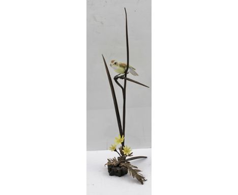 ALBANY (Worcester) A porcelain figure of a Reed Warbler, modelled on a bronzed reed over celandine, impressed "Albany" 