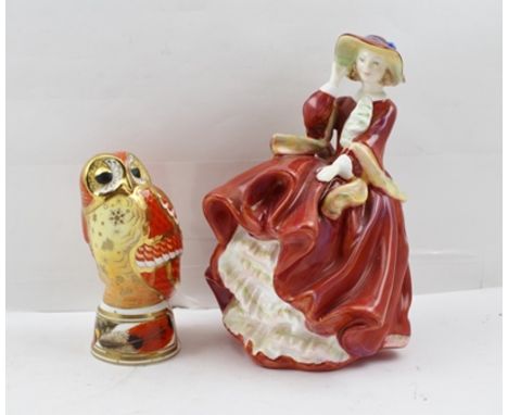 A ROYAL WORCESTER BONE CHINA MODEL OF A TAWNY OWL, raised on a feather decorated base, 11cm high, together with a ROYAL DOULT