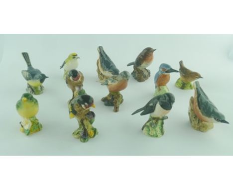 A COLLECTION OF TWELVE BESWICK CERAMIC BIRD FIGURES comprising; 2 x Nuthatch, Stonechat, 2 x Gold Finch, Kingfisher, Chaffinc