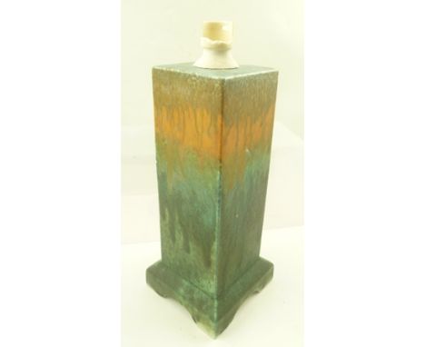 A RUSKIN POTTERY SQUARE FORM CRYSTALLINE GLAZE LAMP BASE, streaked with orange and green, impressed "Ruskin" to base, height 
