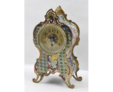 A CONTINENTAL ROCOCO DESIGN CHAMPLEVE ENAMEL DRAWING ROOM MANTEL TIMEPIECE, the gilded dial with Arabic numerals, circa 1910,