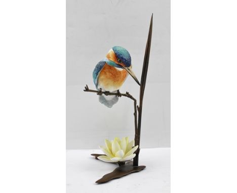 ALBANY (Worcester) A porcelain figure of a Kingfisher modelled resting on a bronzed reed over a lily, impressed "Albany" 