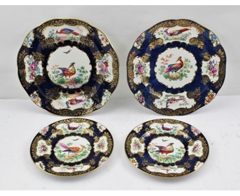 FOUR BOOTHS PLATES, imitating Dr Walls Worcester blue scale design, with decorative panels of exotic birds, two largest 23cm 