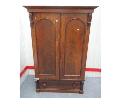 C19th Mahogany Wardrobe on shaped plinth base, 1 long drawer with mother of pearl inset bun handles, domed doors, 2 interior 