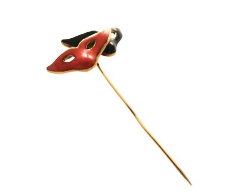 A ; small 18 cts brooch designed as masks addorned by enamel color red and black Grs 4,75 approximately Dimensions 52 x 35 Ap