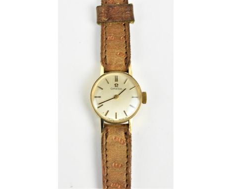 A 9ct gold ladies Omega wristwatch Circa, 1970, having a silvered dial with baton hour markers, A 485 calibre movement on a l