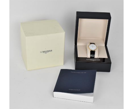 A quartz Longines La Grande Classique. Ref L4 709 1. Gold plated wristwatch having a white dial with Roman numerals on a blac