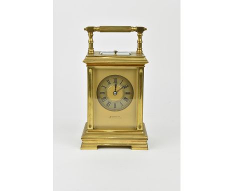 A J. Ullmann &amp; Co. Brass cased repeating and striking carriage clock having a silvered ring dial with Roman numerals. App