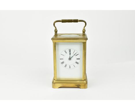 A French brass cased striking carriage clock. With white enamel dial having Roman numerals. Approx 14cm High 